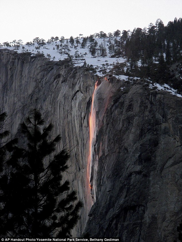 Fiery illusion: Mid-February sunsets in Yosemite National Park lights a natural firefall from Glacier Point illuminating one of the park's lesser-known waterfalls so precisely that it resembles molten lava
